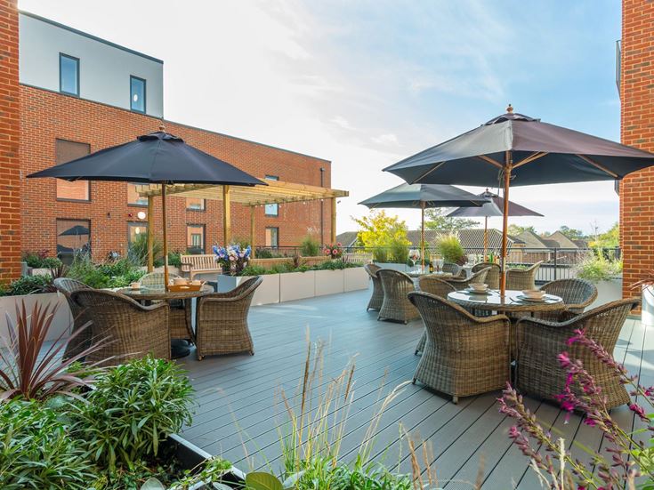 a pool with chairs and umbrellas