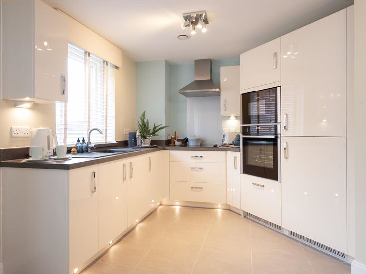 a kitchen with white cabinets