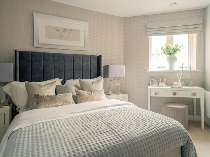 a bed with a white and black striped headboard