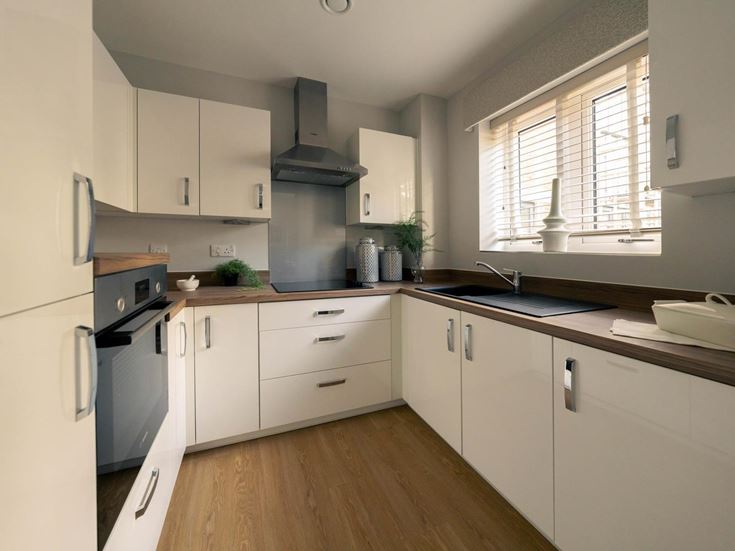 a kitchen with white cabinets