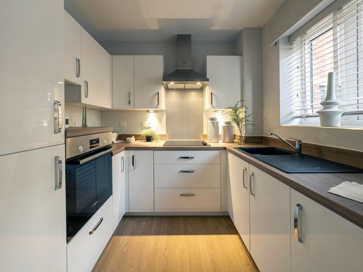 a kitchen with white cabinets