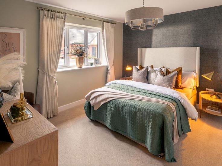 a bedroom with a bed and a desk