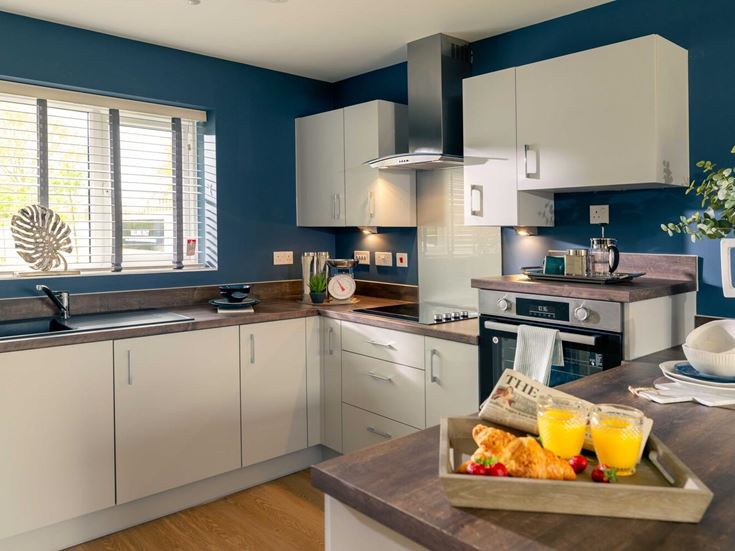 a kitchen with white cabinets