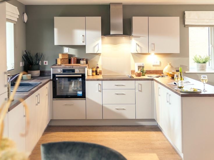 a kitchen with white cabinets