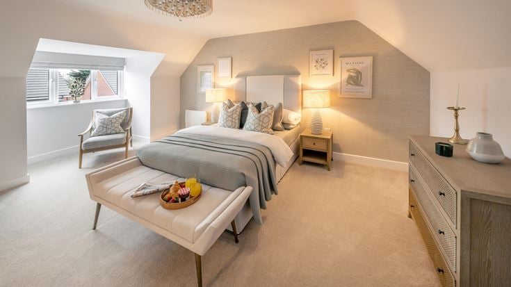 a bedroom with a bed and a coffee table