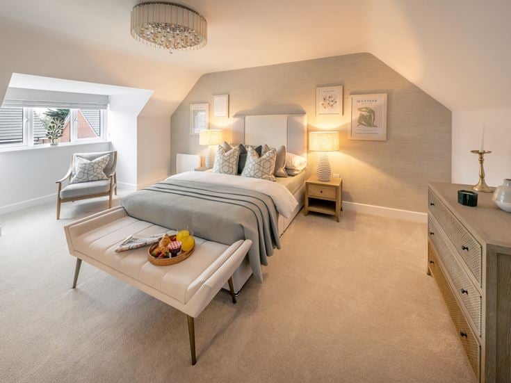 a bedroom with a bed and a coffee table