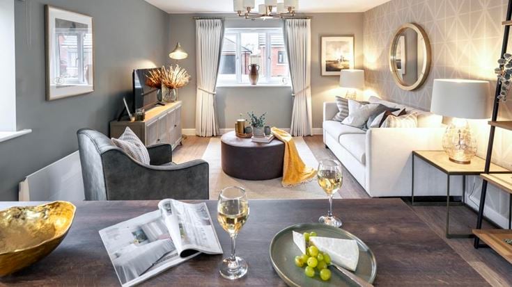 a living room with a couch and a table