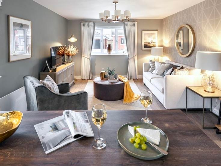 a living room with a couch and a table