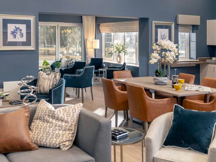 a room with a table and chairs