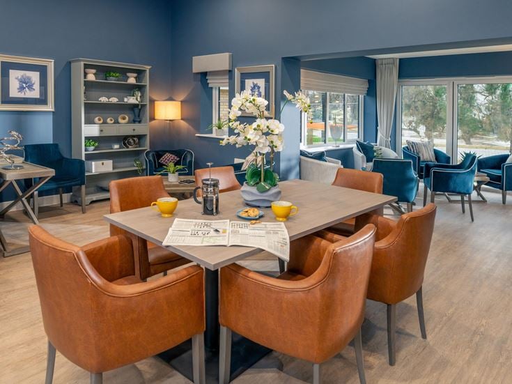 a room with a table and chairs