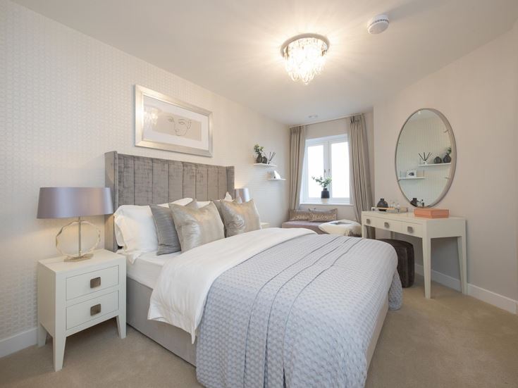 a bedroom with a large mirror
