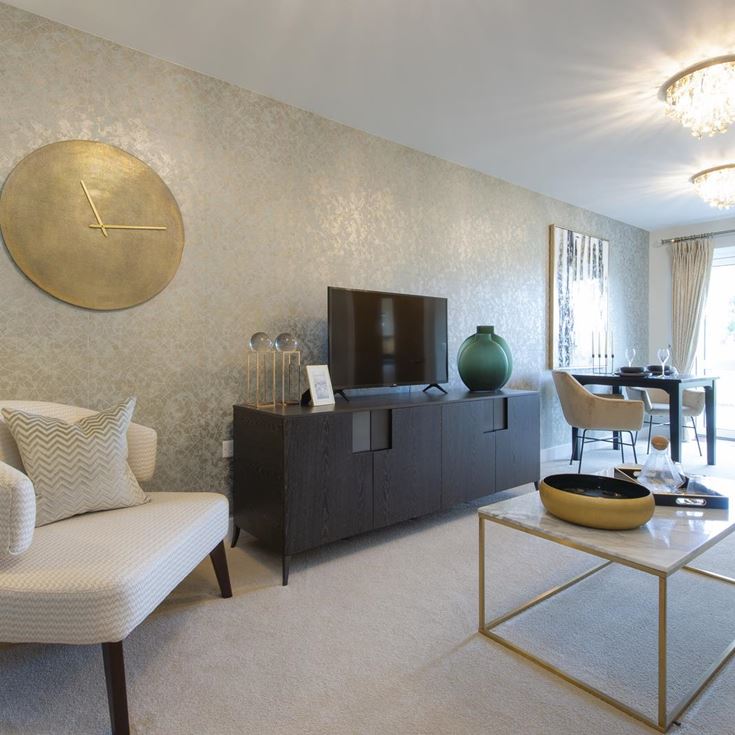 a living room with a white couch and a round table
