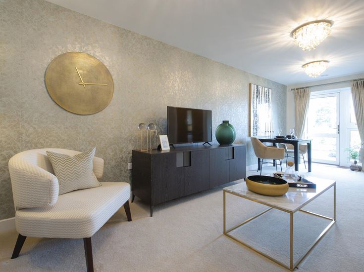 a living room with a white couch and a round table