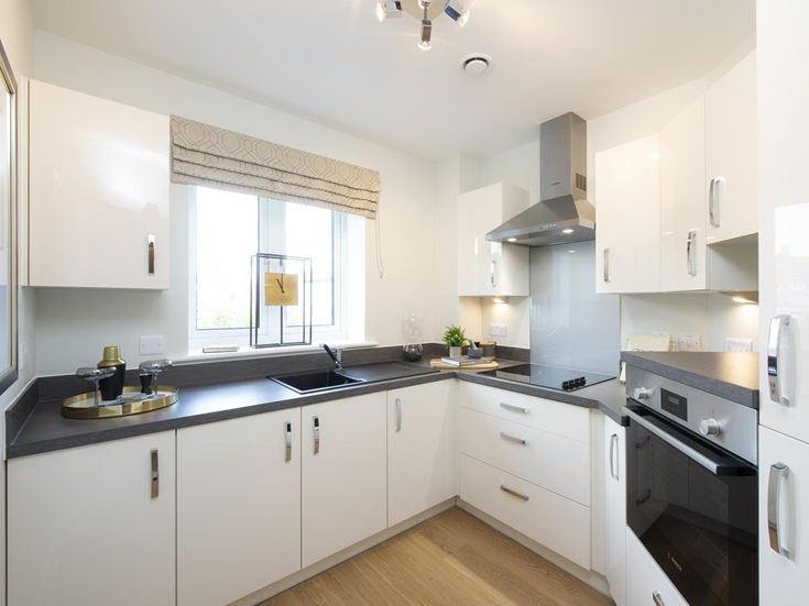 a kitchen with white cabinets