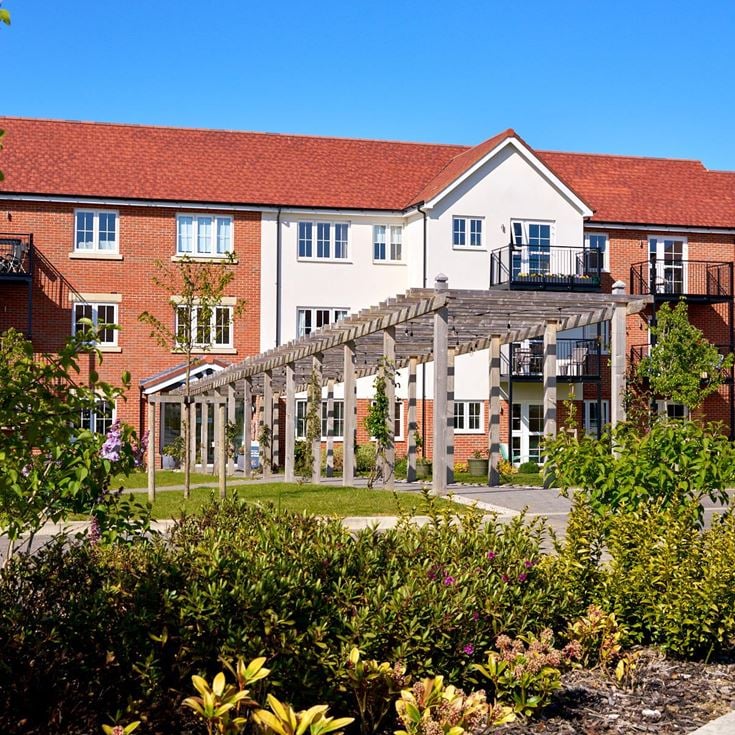 a building with a garden in front