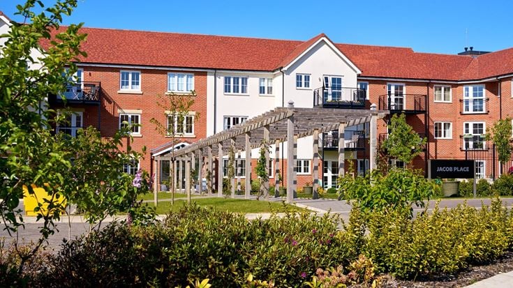 a building with a garden in front