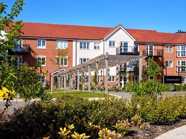 a building with a garden in front