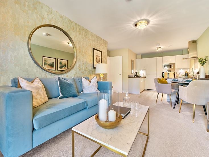 a living room with a blue couch