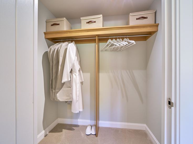 a closet with clothes