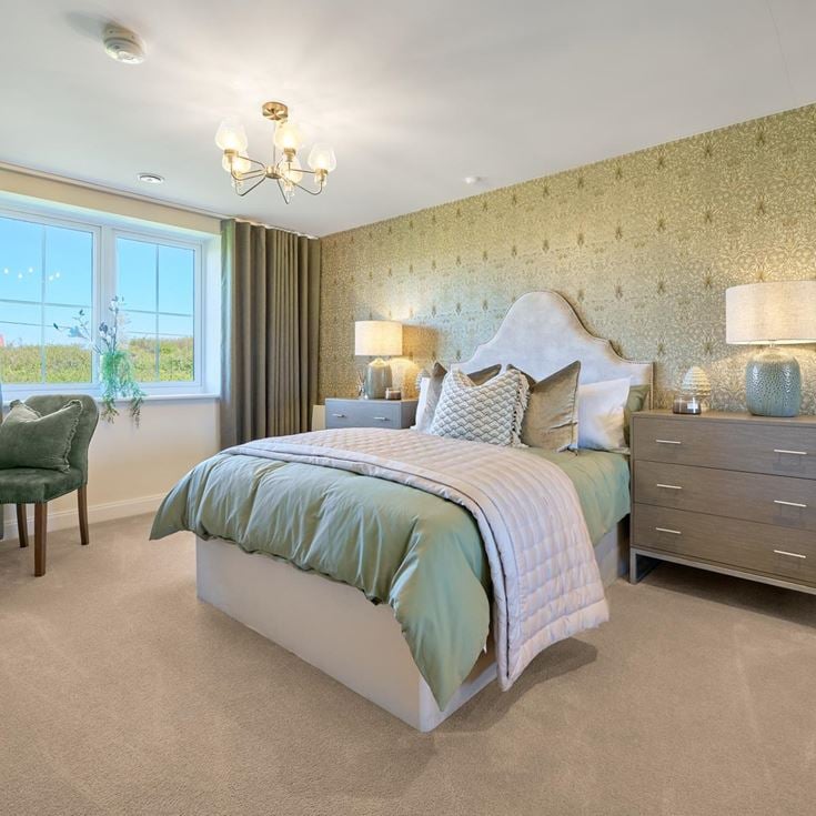 a bedroom with a bed and a desk