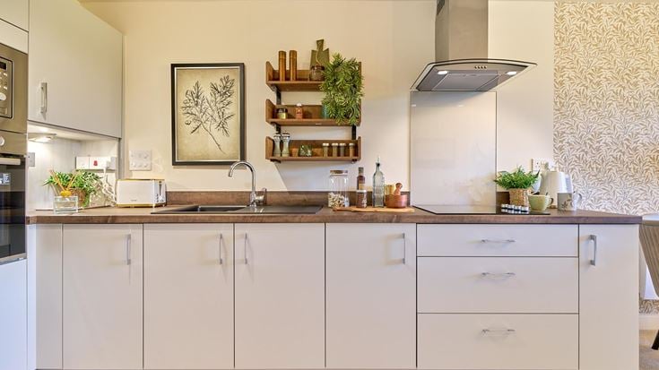 a kitchen with white cabinets