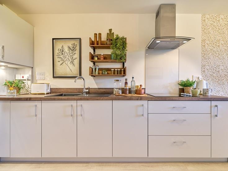 a kitchen with white cabinets