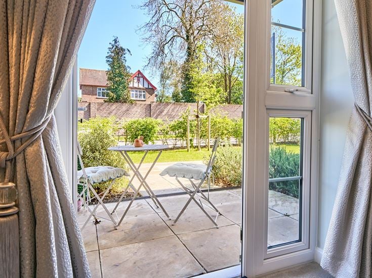 a patio with a table and chairs