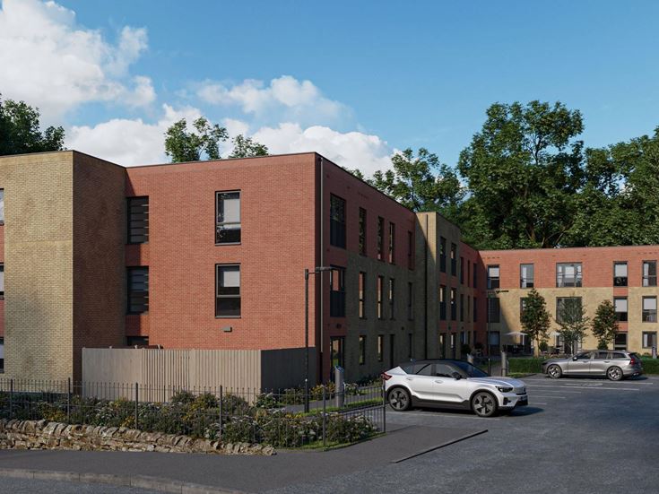 a brick building with cars parked in front of it