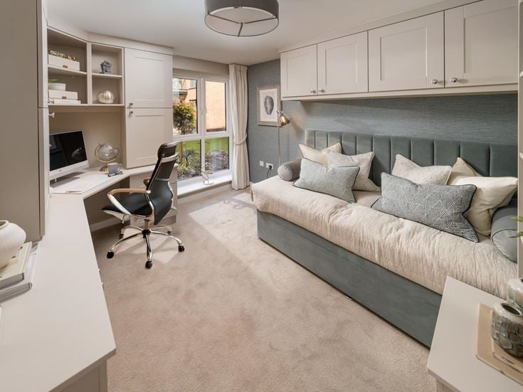 a room with a couch and a desk