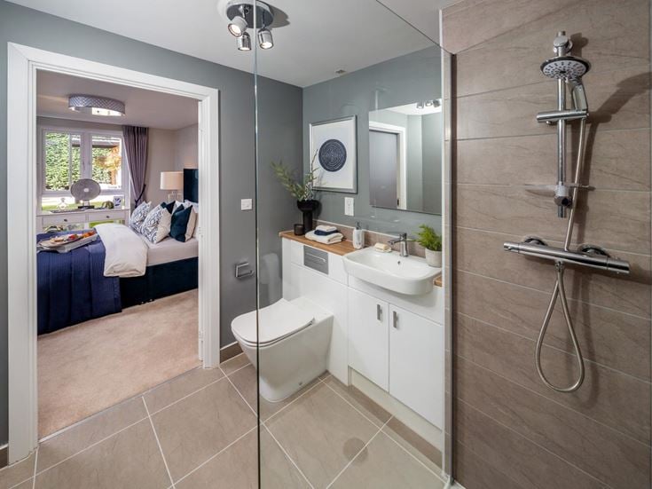 a bathroom with a shower and sink
