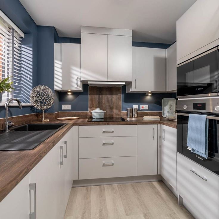 a kitchen with white cabinets
