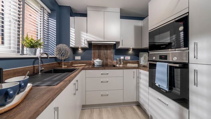 a kitchen with white cabinets