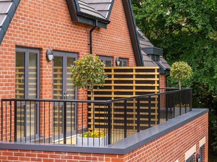 a house with a black railing