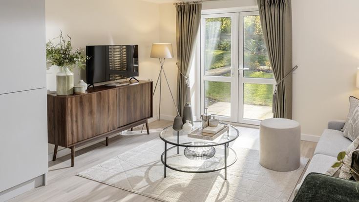 a living room with a tv and a table
