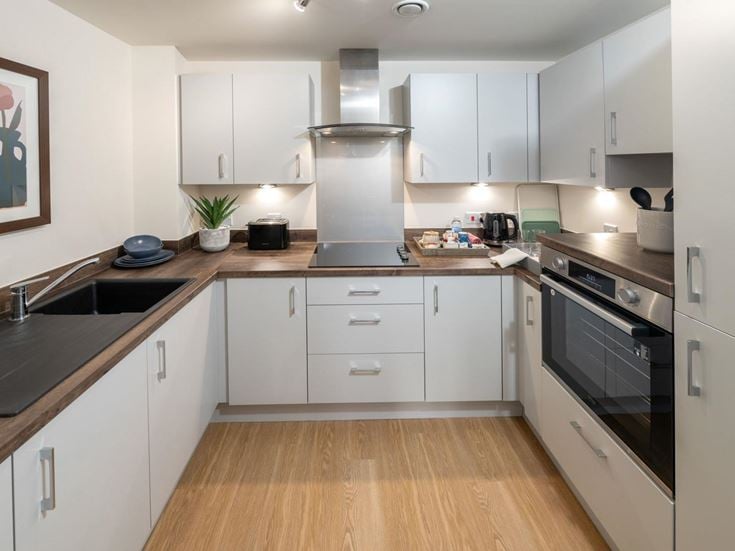 a kitchen with white cabinets