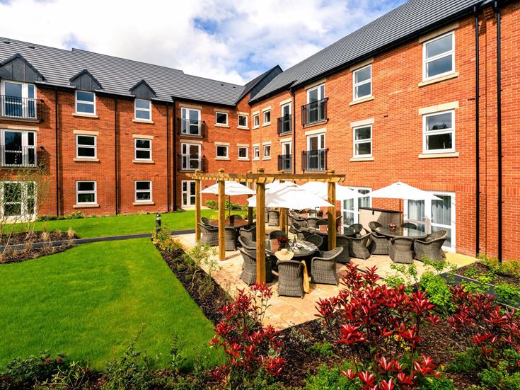 a brick building with a garden