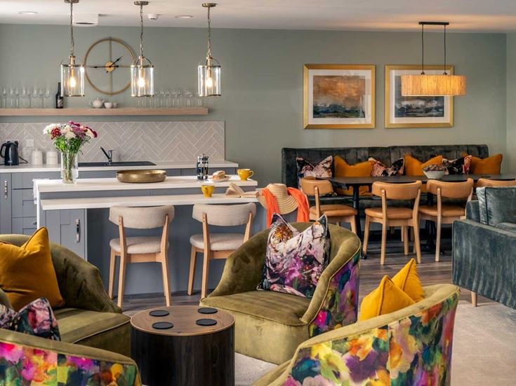 a living room with a kitchen and dining area