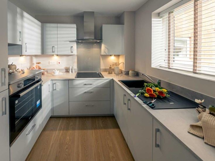a kitchen with white cabinets