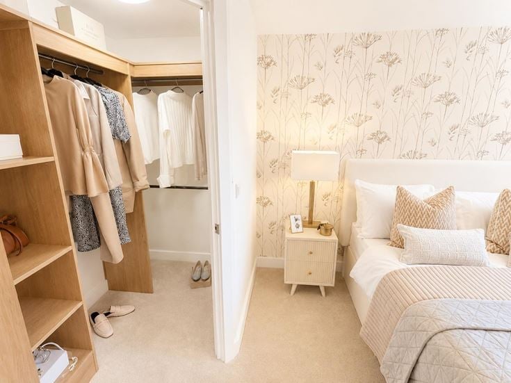 a bedroom with a bed and a closet