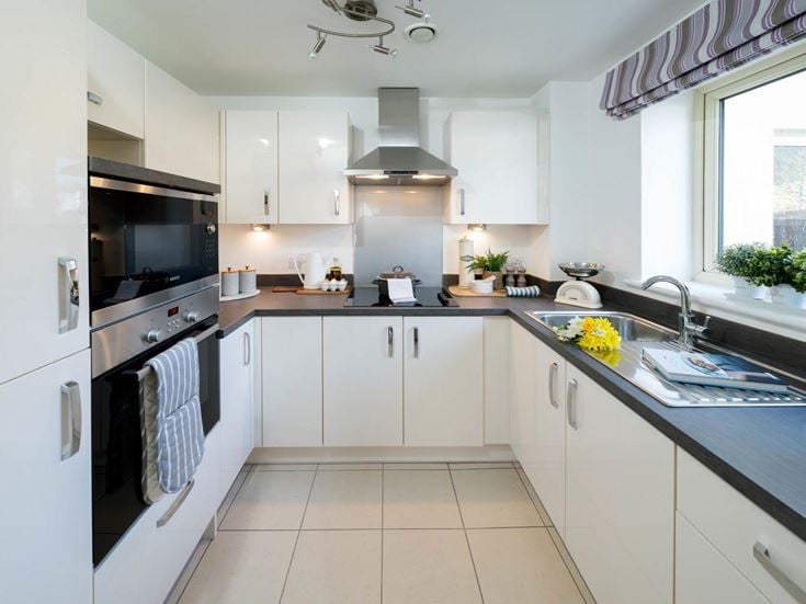 a kitchen with white cabinets