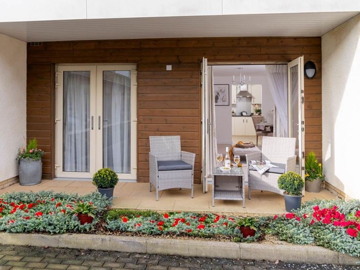 a house with a patio and chairs