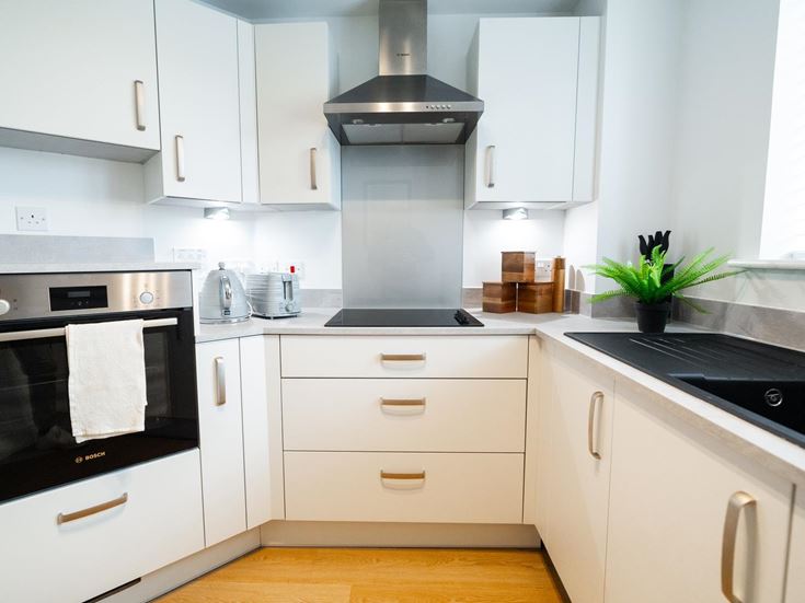 a kitchen with white cabinets