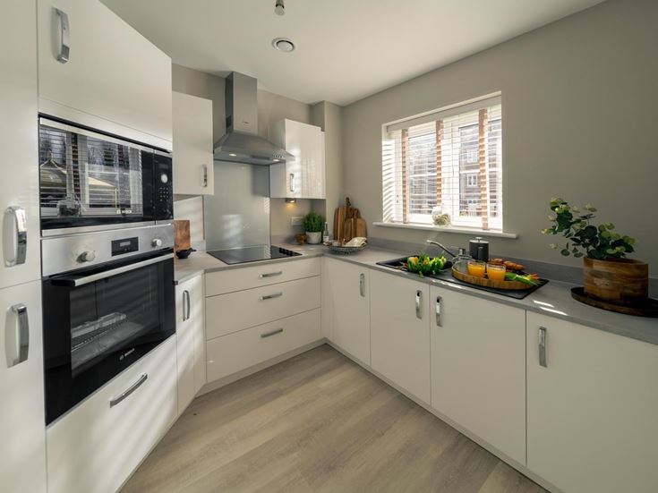a kitchen with white cabinets