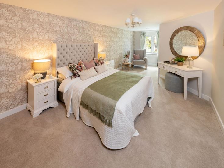 a bedroom with a bed and a mirror