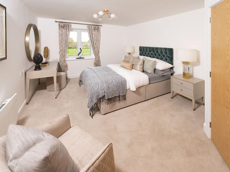 a bedroom with a bed and a couch