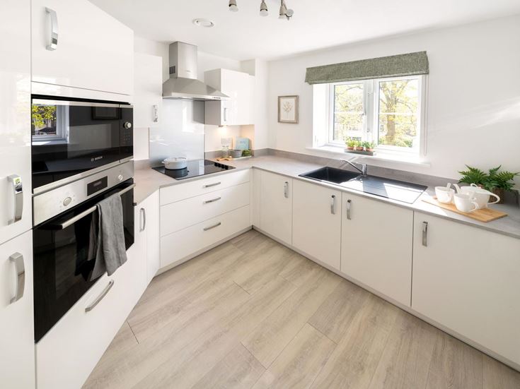 a kitchen with white cabinets