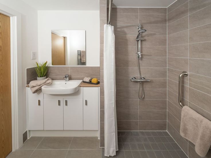 a bathroom with a shower and sink