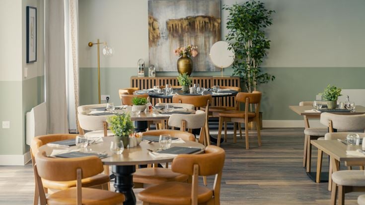 a room with tables and chairs