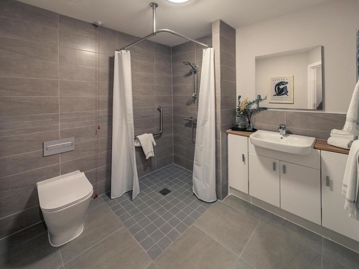 a bathroom with a shower and toilet