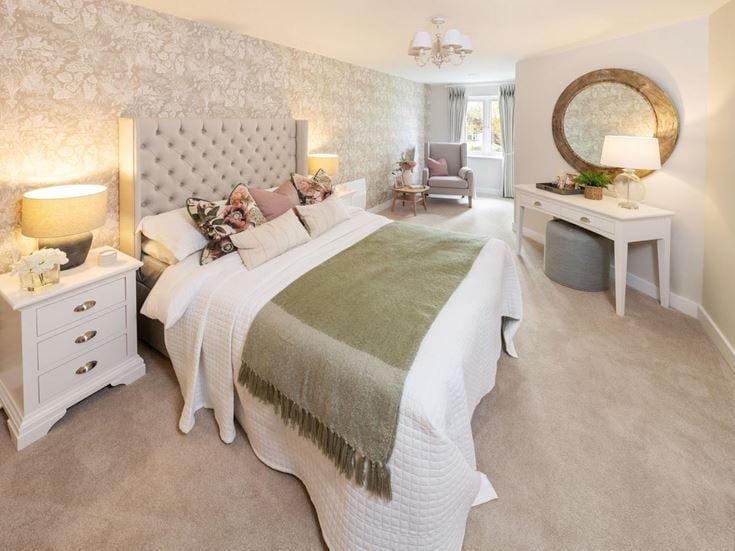 a bedroom with a bed and a mirror
